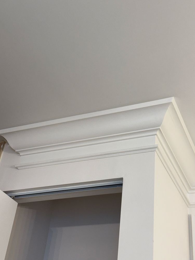 Close-up mitered joint and trim detail of architectural crown molding in Jupiter FL