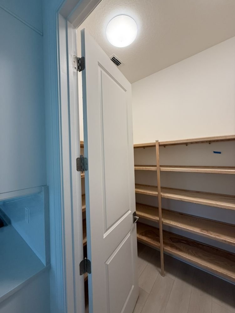Built-in solid wood pantry shelving installation in Jupiter FL