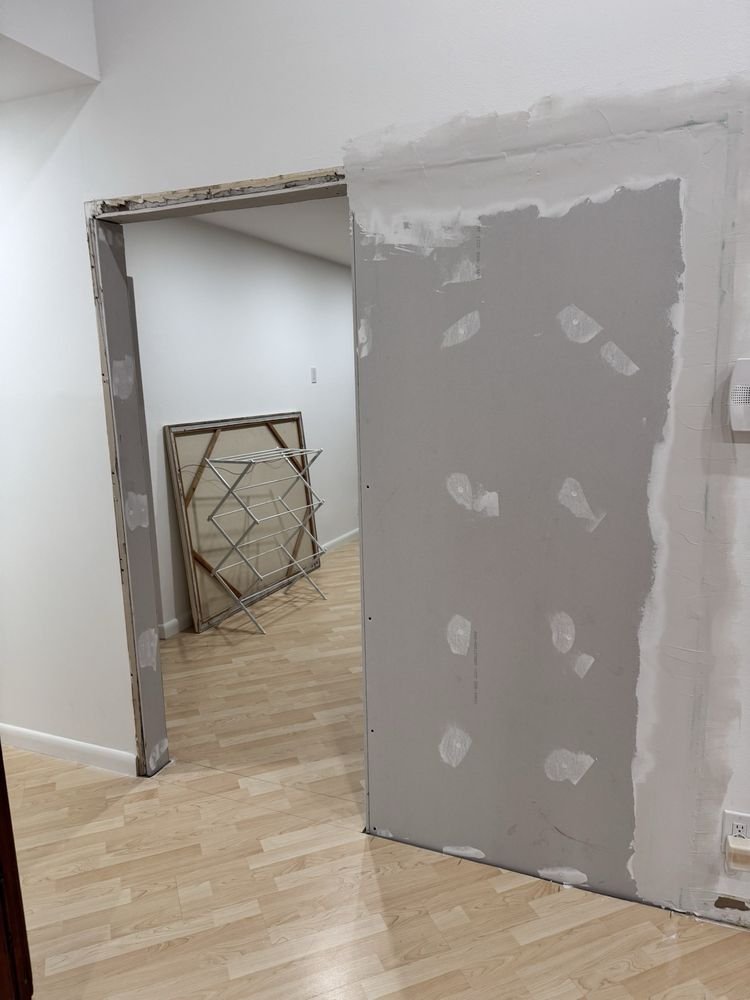 Drywall hanging and joint compound taping around doorway in Jupiter FL