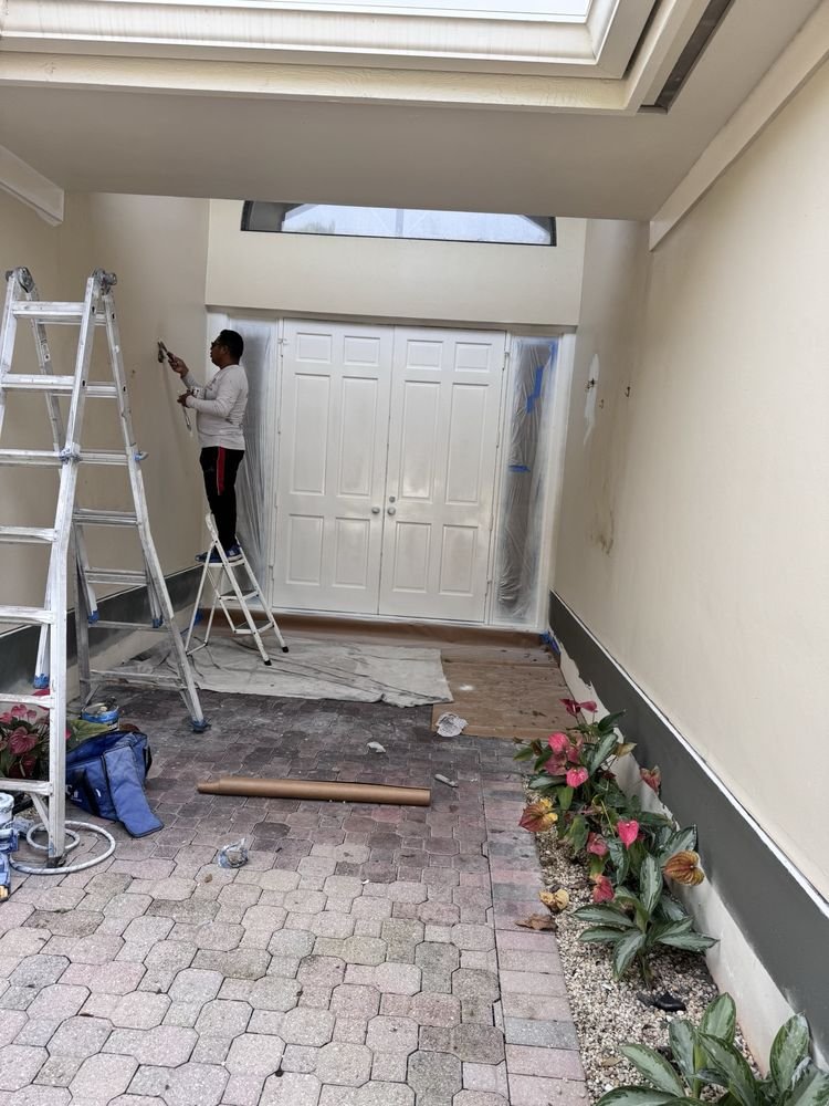 Entryway courtyard wall preparation and stucco painting in Jupiter FL