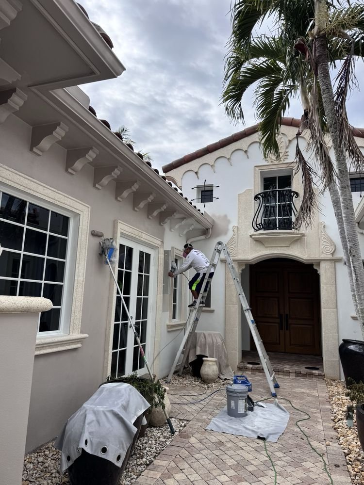 Mediterranean courtyard stucco prep and exterior painting in Jupiter FL