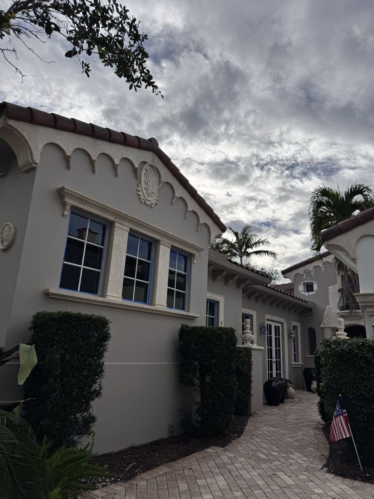 Mediterranean coastal estate exterior stucco repaint and walkway in Jupiter FL